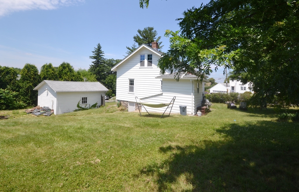118 King Philip Road Worcester, MA 01606 - Photo 27 of 28 a view of a house with a yard and sitting area