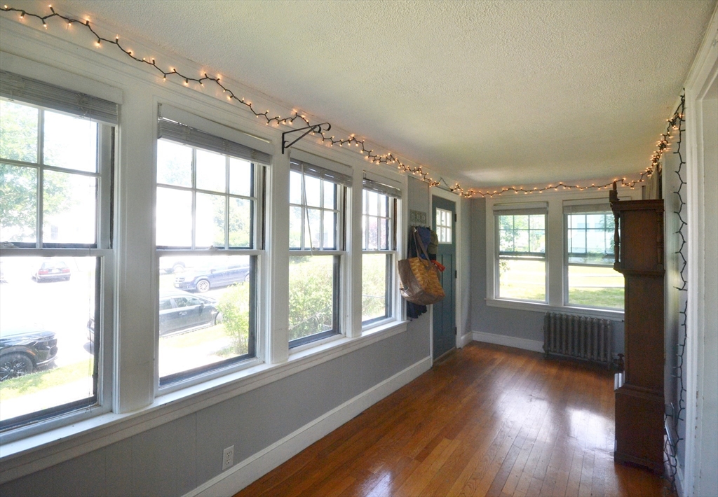 118 King Philip Road Worcester, MA 01606 - Photo 9 of 28 an empty room with wooden floor and windows