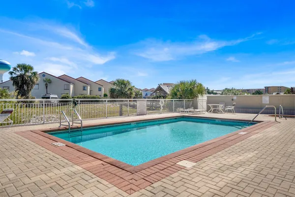 a view of a swimming pool with a lake view