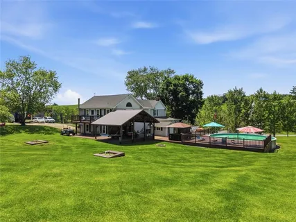 a view of a swimming pool with a patio