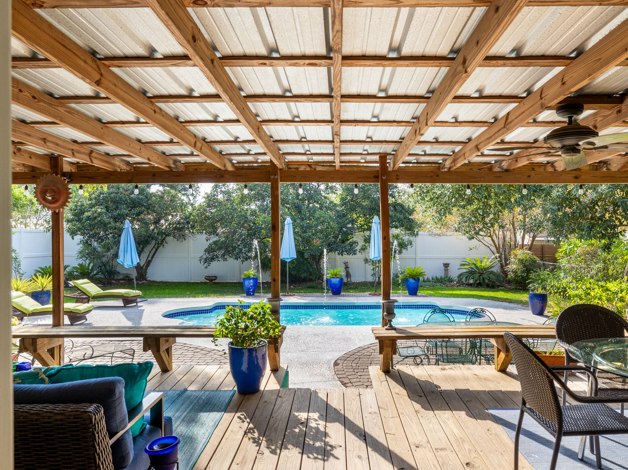 4710 Frontier Trail Austin, TX 78745 - Photo 25 of 32 a view of a patio with a table chairs and a backyard