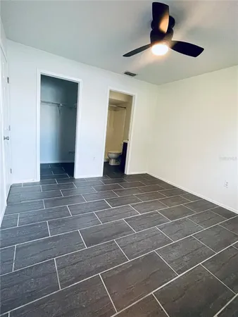 a view of an empty room with white walls