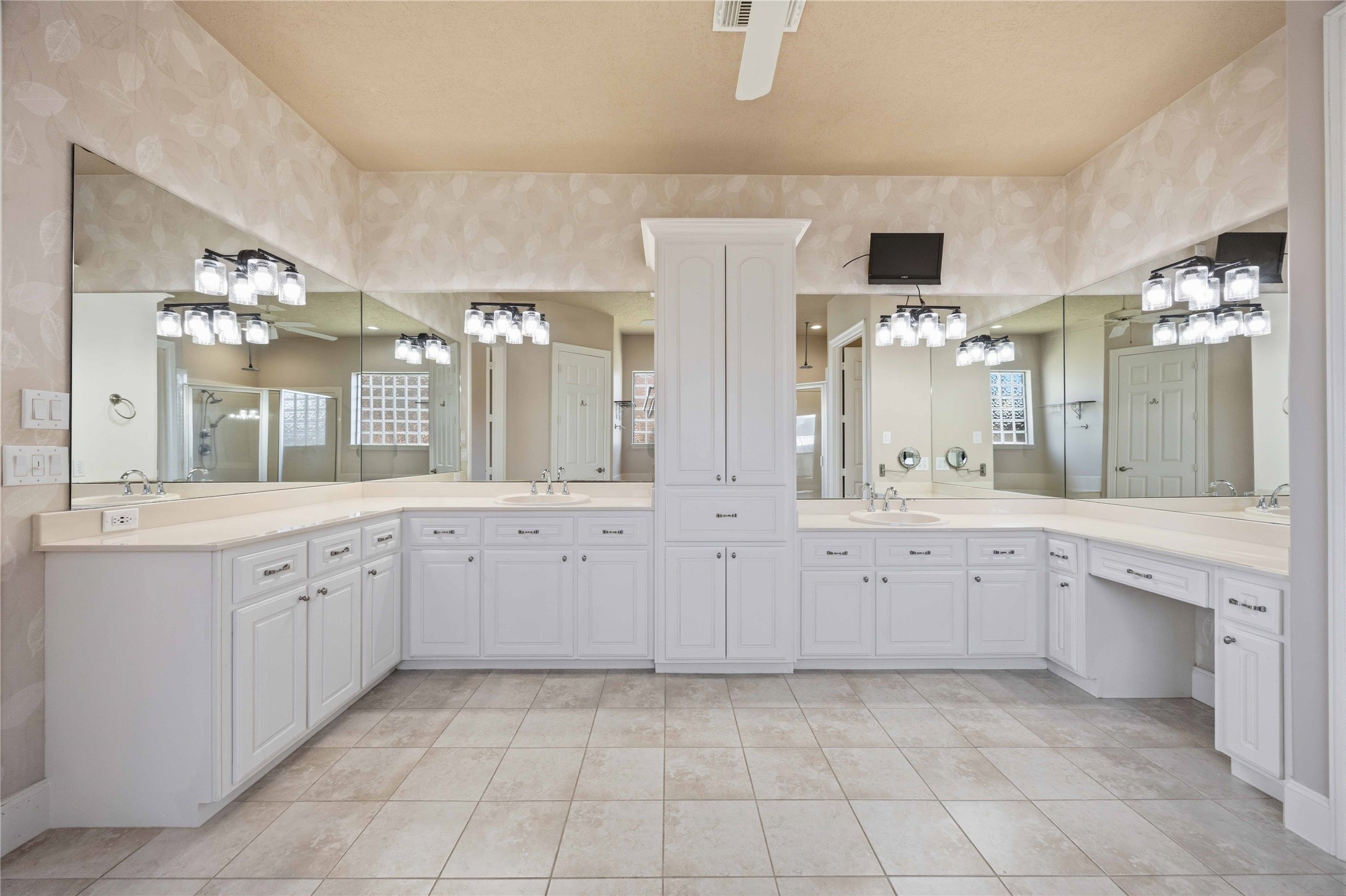 1930 Old River Road Montgomery, TX 77356 - Photo 25 of 49 Across from the jetted tub and shower, you'll find plenty of room to get ready in this luxurious bath. Separate sinks, tons of counter space, and ample cabinets for linens and storage.