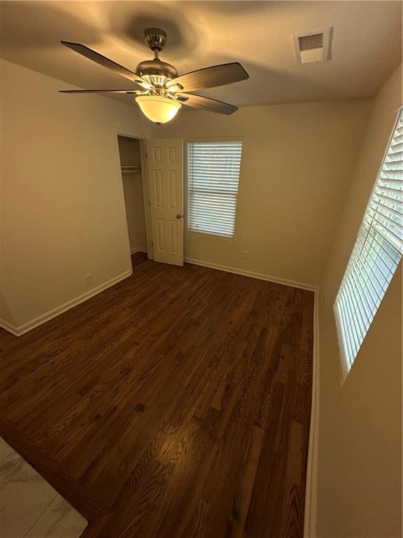 1577 Campbellton Road Southwest Atlanta, GA 30311 - Photo 13 of 23 a view of an empty room with wooden floor and a window