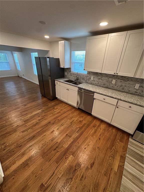 1577 Campbellton Road Southwest Atlanta, GA 30311 - Photo 17 of 23 a large kitchen with stainless steel appliances granite countertop a stove a sink and a refrigerator