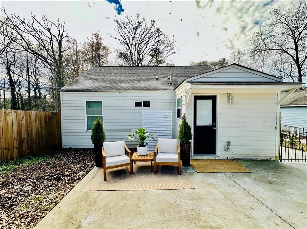 1577 Campbellton Road Southwest Atlanta, GA 30311 - Photo 22 of 23 a view of a house with backyard and sitting area