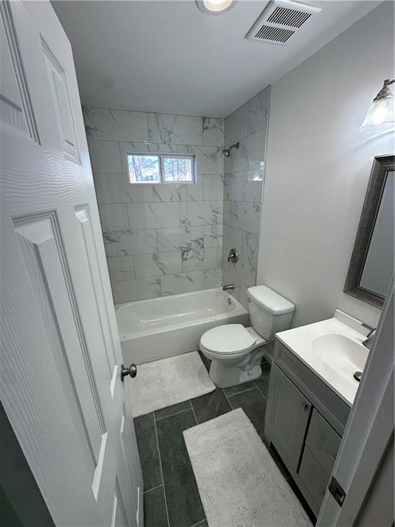 1577 Campbellton Road Southwest Atlanta, GA 30311 - Photo 23 of 23 a bathroom with a sink a toilet a tub and shower