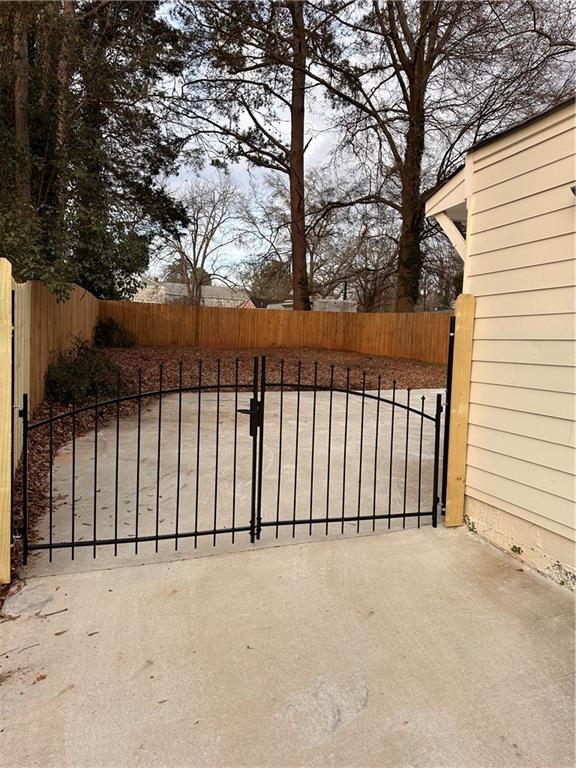 1577 Campbellton Road Southwest Atlanta, GA 30311 - Photo 5 of 23 a view of a gate of a house