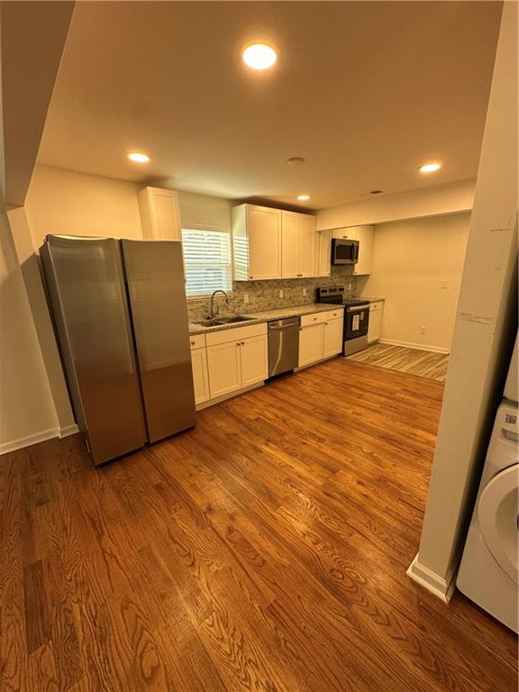 1577 Campbellton Road Southwest Atlanta, GA 30311 - Photo 8 of 23 a view of kitchen with wooden floor