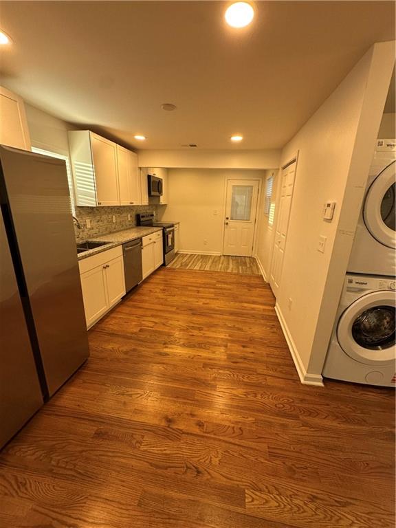 1577 Campbellton Road Southwest Atlanta, GA 30311 - Photo 9 of 23 a view of a kitchen with cabinets and wooden floor