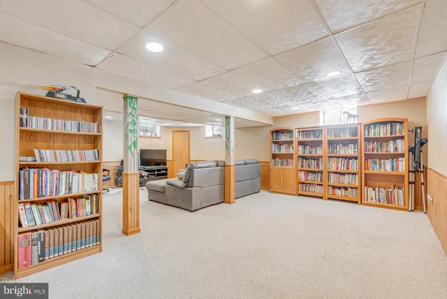 a view of an empty room with furniture