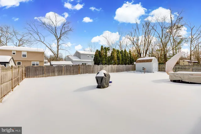 a view of a house with a snow in the yard