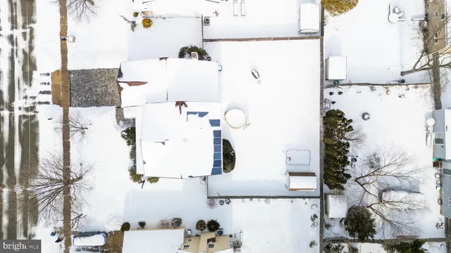 an aerial view of residential house with outdoor space and parking