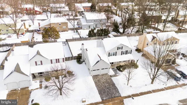 view of the house with yard and sitting area