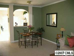 727 Shellstone Place, Unit 727 Fort Mill, SC 29708 - Photo 2 of 5 a view of a dining room with furniture and a potted plant