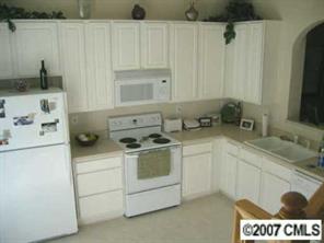727 Shellstone Place, Unit 727 Fort Mill, SC 29708 - Photo 4 of 5 a kitchen with a sink stove and cabinets