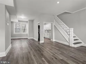 a view of an entryway with wooden floor