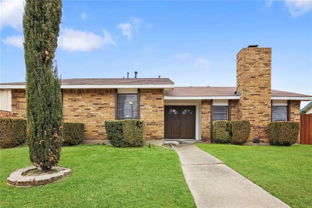 10205 Catalpa Road Dallas, TX 75243 - Photo 1 of 1 a front view of a house with a garden