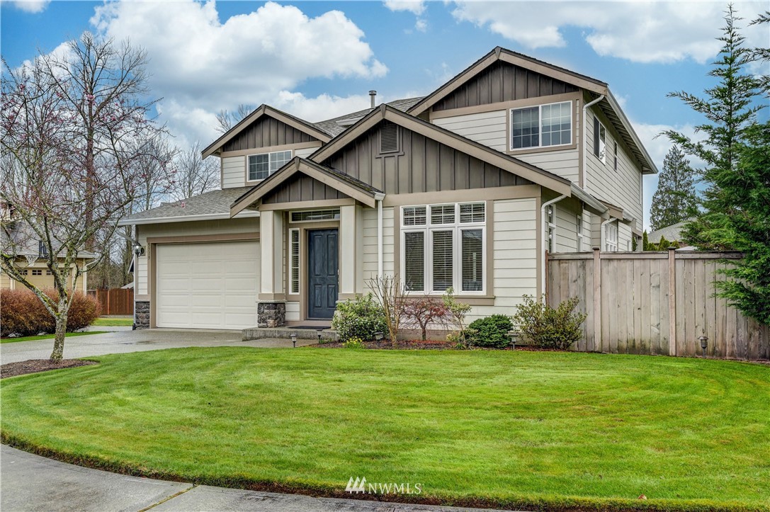 5719 Northeast 3rd Street Renton, WA 98059 - Photo 2 of 40 a front view of house with yard and green space