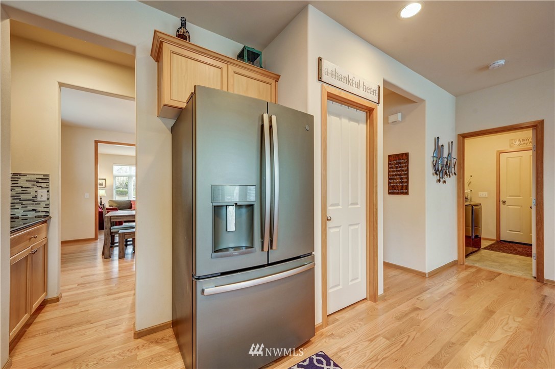 5719 Northeast 3rd Street Renton, WA 98059 - Photo 15 of 40 a bathroom with a glass shower door and a mirror