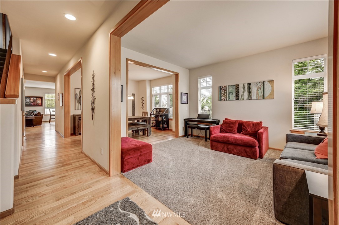 5719 Northeast 3rd Street Renton, WA 98059 - Photo 4 of 40 a living room with furniture and a wooden floor