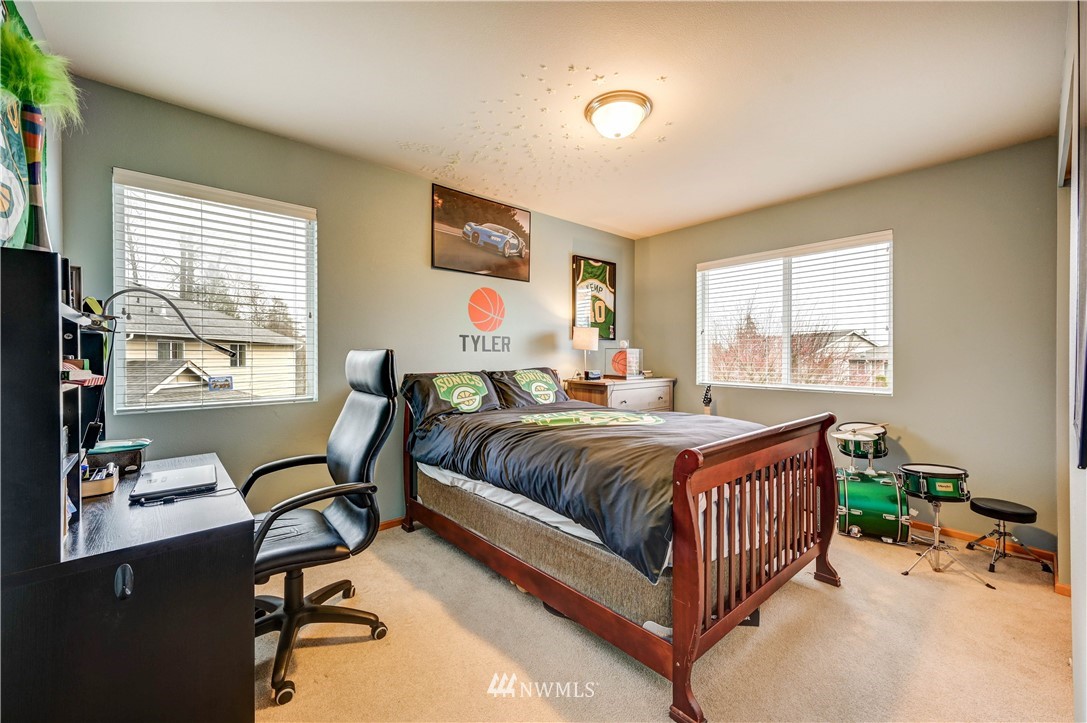 5719 Northeast 3rd Street Renton, WA 98059 - Photo 31 of 40 a bedroom with a bed and a desk