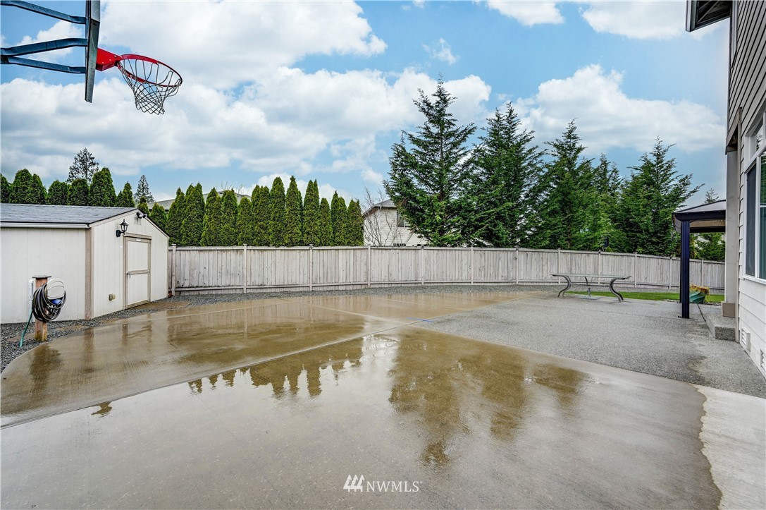 5719 Northeast 3rd Street Renton, WA 98059 - Photo 34 of 40 a view of a swimming pool with a yard