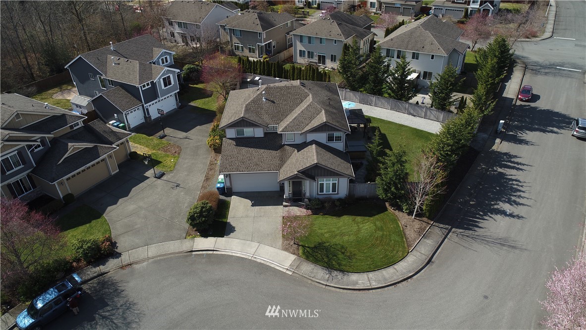 5719 Northeast 3rd Street Renton, WA 98059 - Photo 38 of 40 an aerial view of a house with outdoor space and a lake view