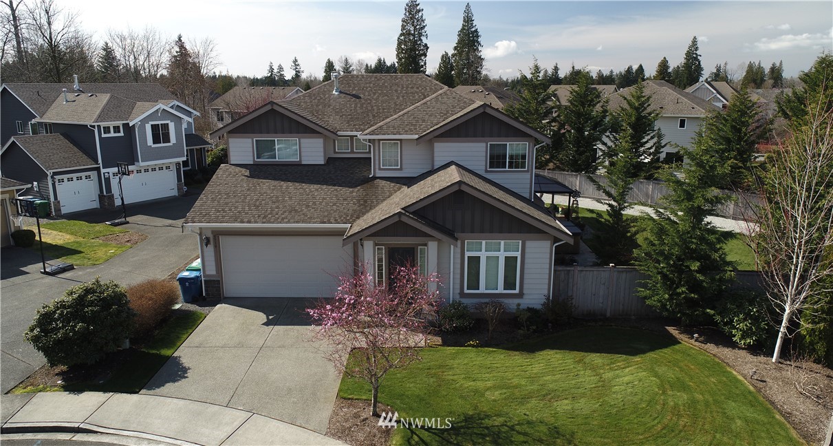 5719 Northeast 3rd Street Renton, WA 98059 - Photo 40 of 40 a front view of a house with a garden