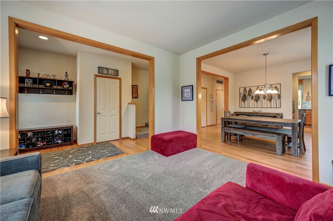 5719 Northeast 3rd Street Renton, WA 98059 - Photo 6 of 40 a bedroom with furniture and a mirror