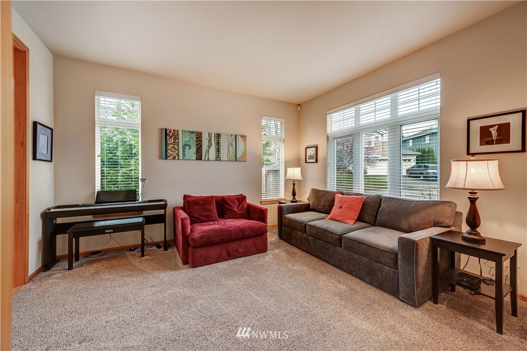 5719 Northeast 3rd Street Renton, WA 98059 - Photo 8 of 40 a living room with furniture and a window