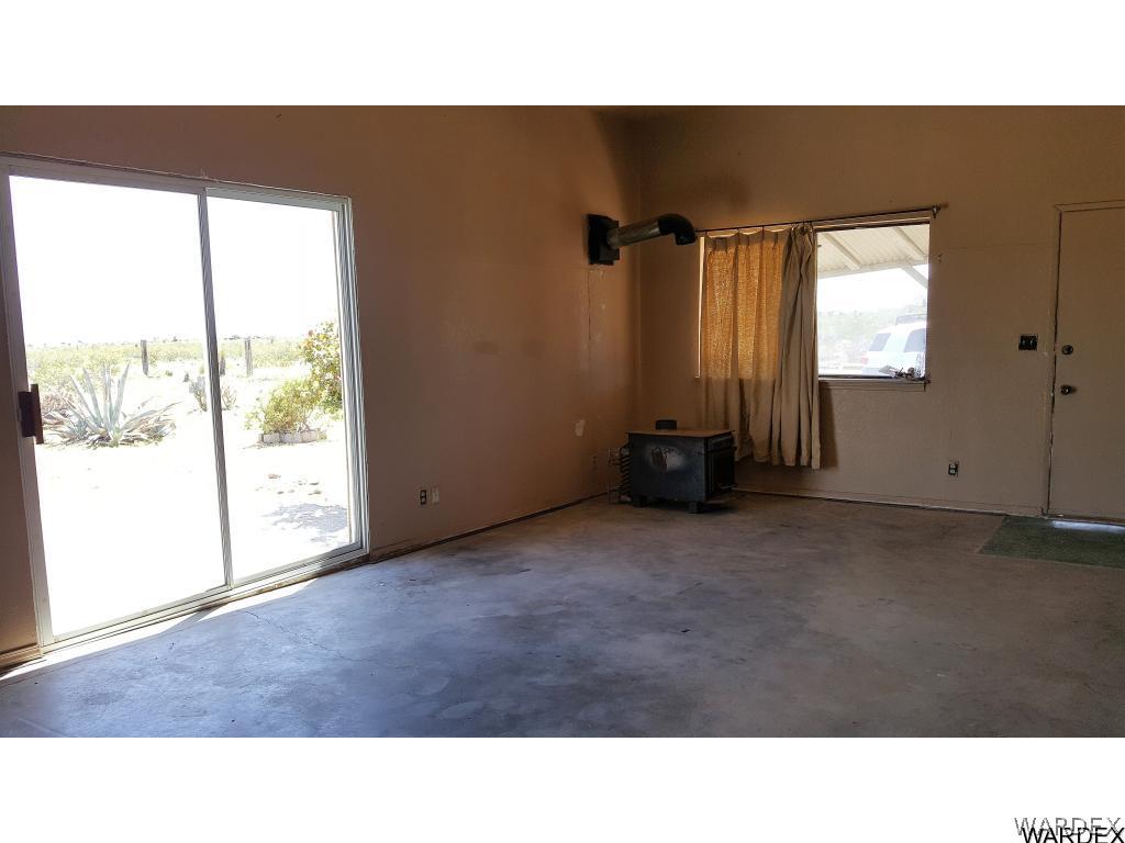 1385 Egar Road Golden Valley, AZ 86413 - Photo 18 of 31 Sliding doors let in light