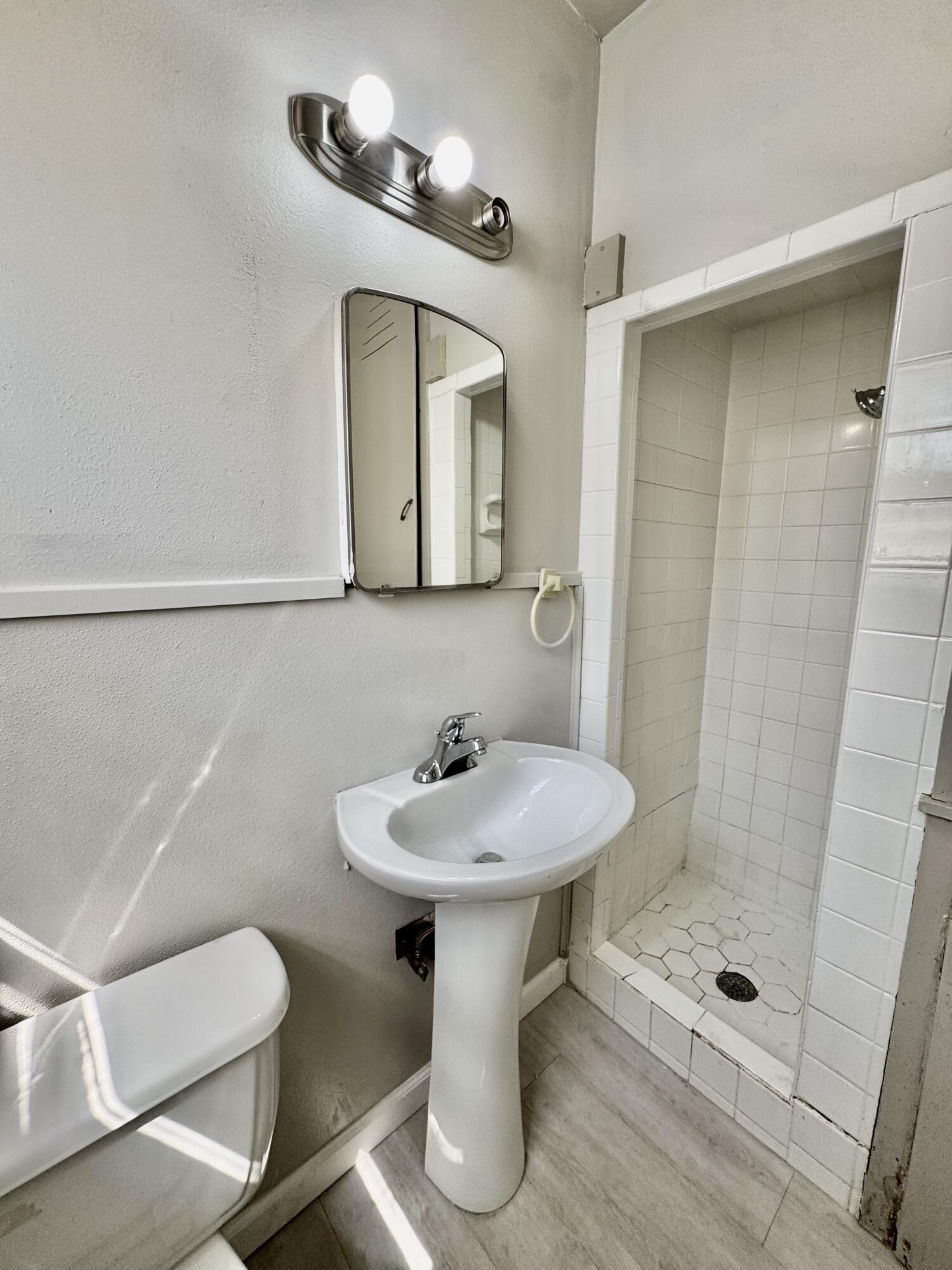 3805 35th Street Lubbock, TX 79413 - Photo 7 of 11 a bathroom with a sink toilet and shower