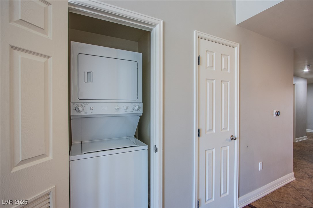 150 South Las Vegas Boulevard, Unit 1212 Las Vegas, NV 89101 - Photo 23 of 45 Laundry room with estacked washer and dryer and baseboards