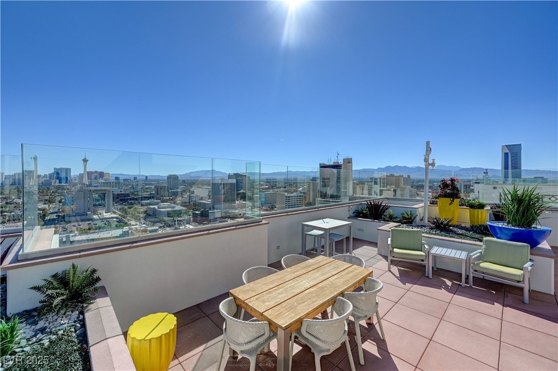 150 South Las Vegas Boulevard, Unit 1212 Las Vegas, NV 89101 - Photo 35 of 45 View of patio / terrace with a view of city and a mountain view