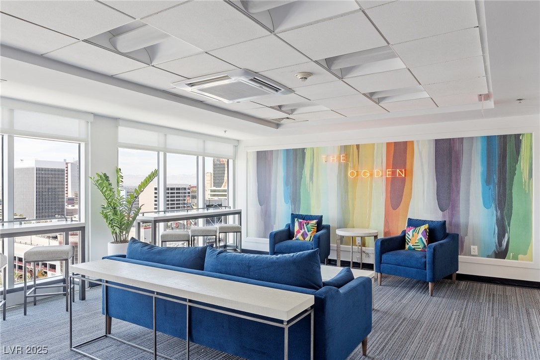 150 South Las Vegas Boulevard, Unit 1212 Las Vegas, NV 89101 - Photo 40 of 45 Living room featuring carpet and a city view