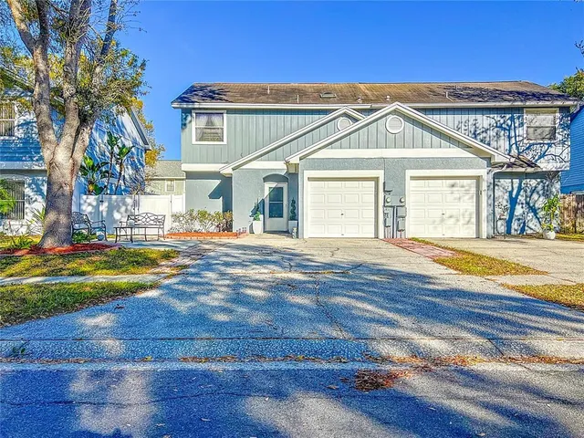 a view of the house with a yard