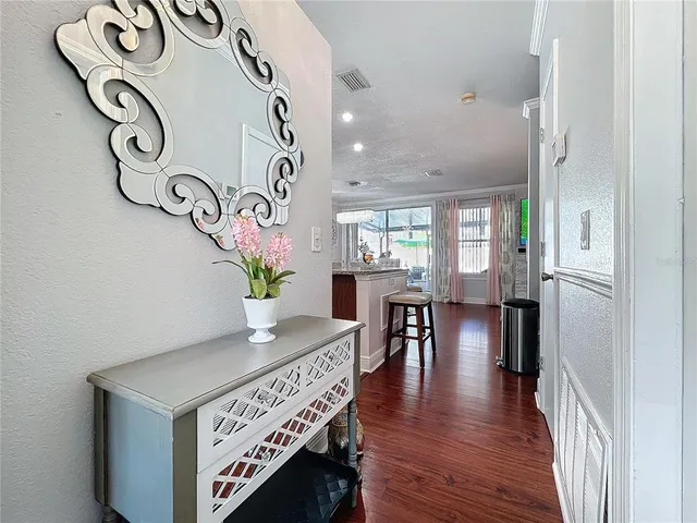 a view of entryway with wooden floor