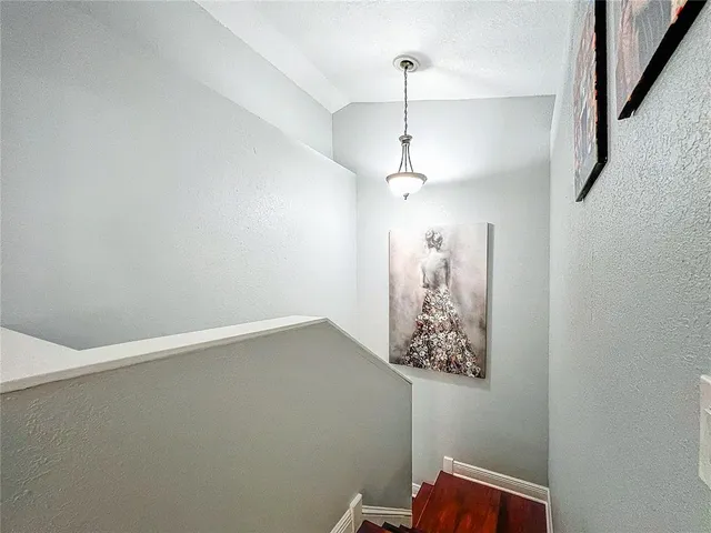 a living room with a flat screen tv and a fireplace