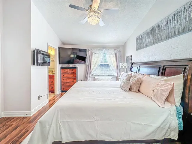 a white toilet sitting next to a shower curtain