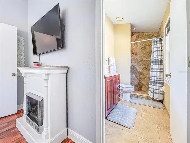 a view of an house with swimming pool and sitting area