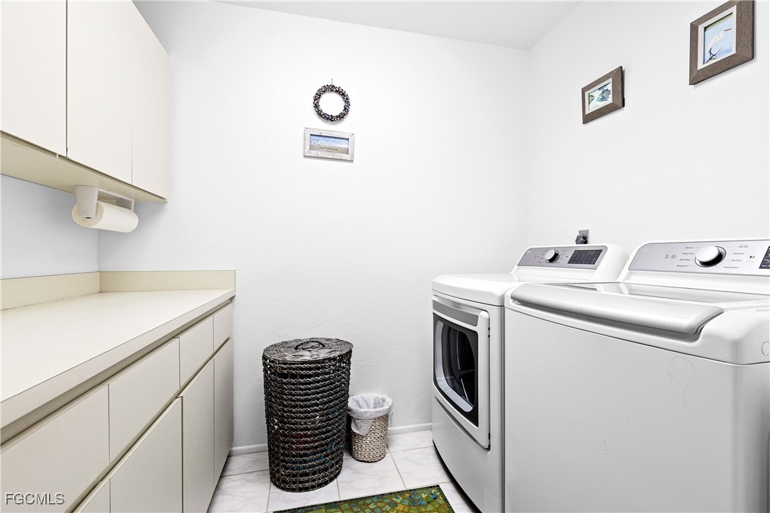 2831 Janet Street Matlacha, FL 33993 - Photo 15 of 43 a utility room with dryer and washer