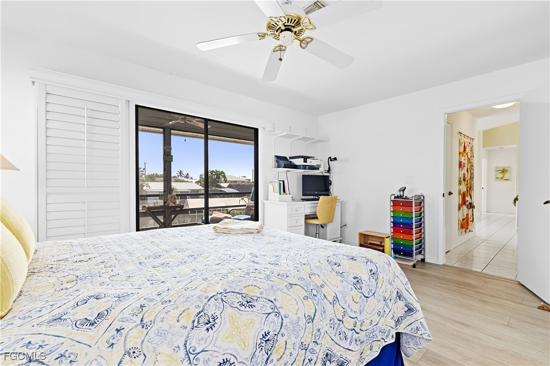 2831 Janet Street Matlacha, FL 33993 - Photo 17 of 43 a bedroom with a large bed and a large window