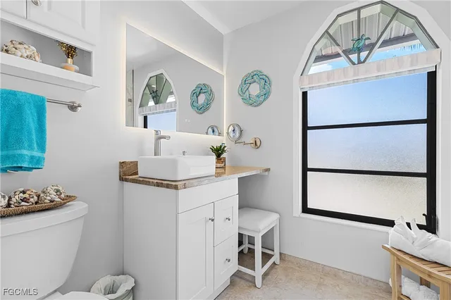 a bathroom with a window and a shower