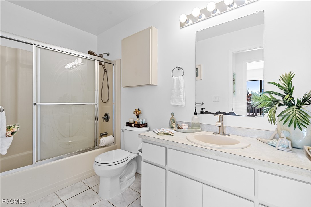 2831 Janet Street Matlacha, FL 33993 - Photo 22 of 43 a bathroom with a toilet a sink and shower