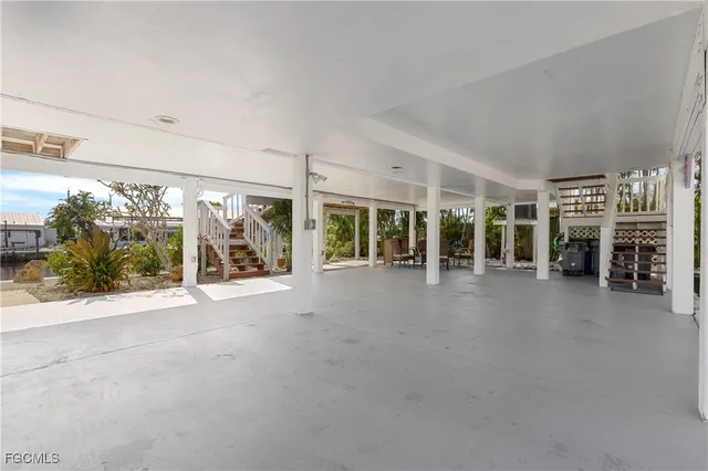 a view of a patio with a dining table and chairs