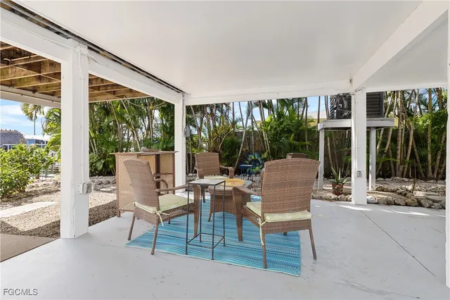a view of a chairs and table in a patio