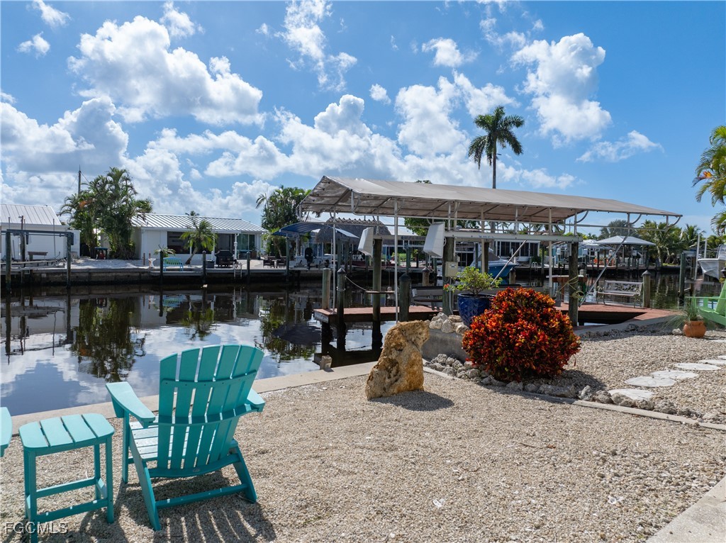 2831 Janet Street Matlacha, FL 33993 - Photo 29 of 43 a view of a chairs and table in a patio