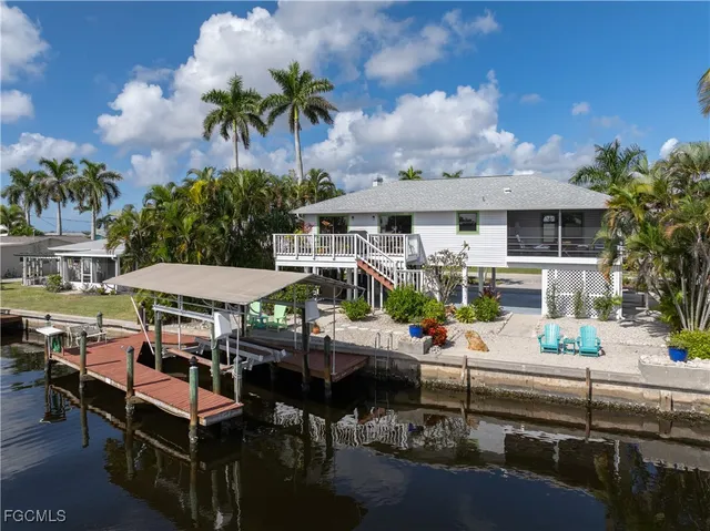 an aerial view of a house with lake view