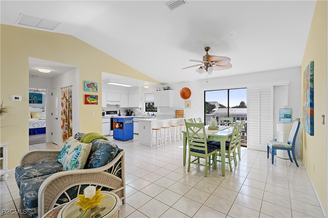 2831 Janet Street Matlacha, FL 33993 - Photo 5 of 43 a living room with furniture a chandelier and a dining table